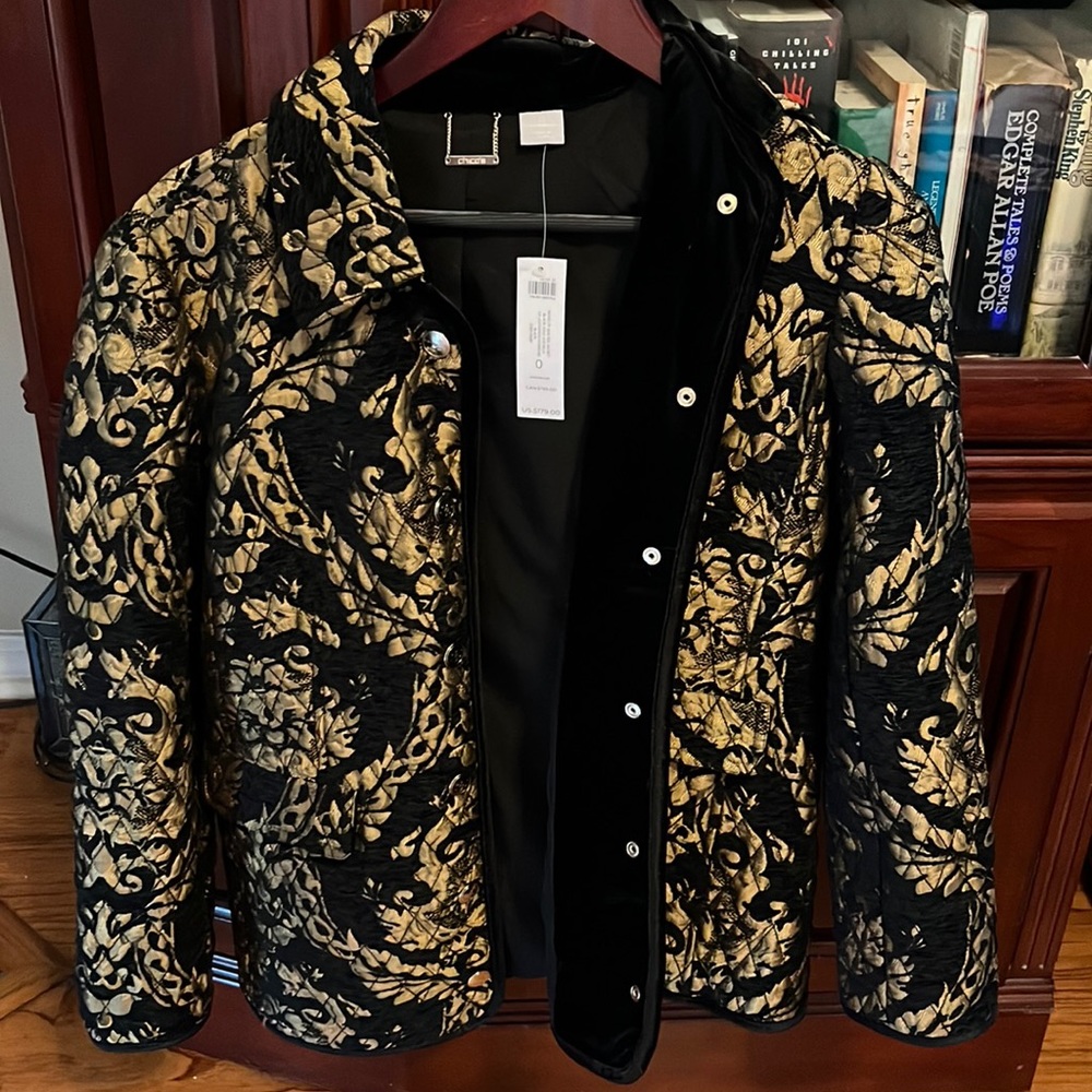 Beautiful quilted jacket from Chicos NWT.  Black and gold snap up jacket size 0.